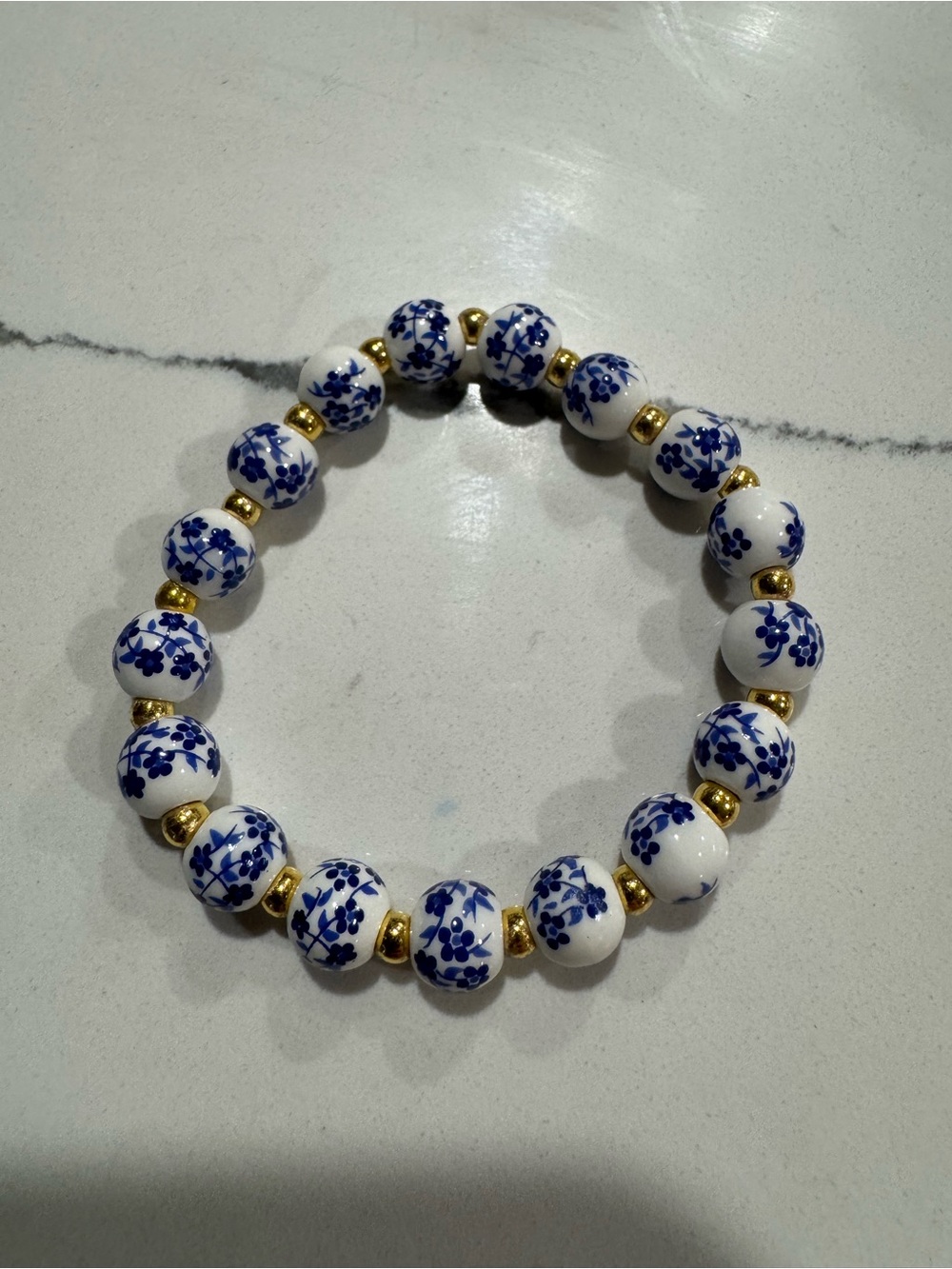 Blue & White Floral Ceramic Beaded Stretch Bracelet with Gold Accents
